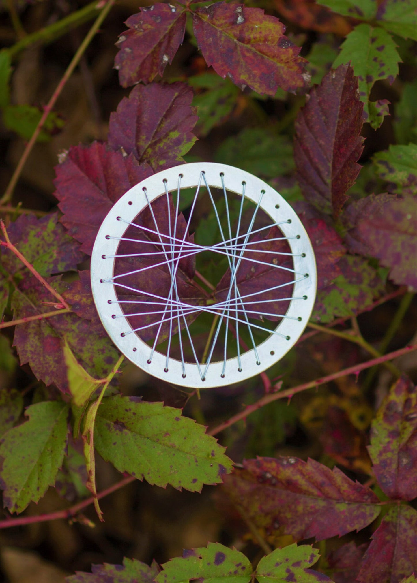 "Tierra" Circular Sterling Silver Wire Wrap Pendant